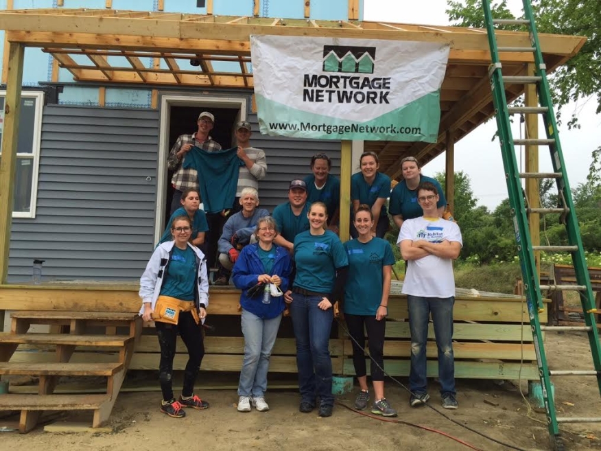 Staffers from the Portland, Maine branch office of Mortgage Network Inc. spent a recent weekend helping to build homes for needy families through Habitat for Humanity of Greater Portland