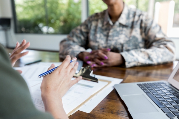 Photo of a military member getting a home loan. Credit: iStockphoto.com/SDI Productions.
