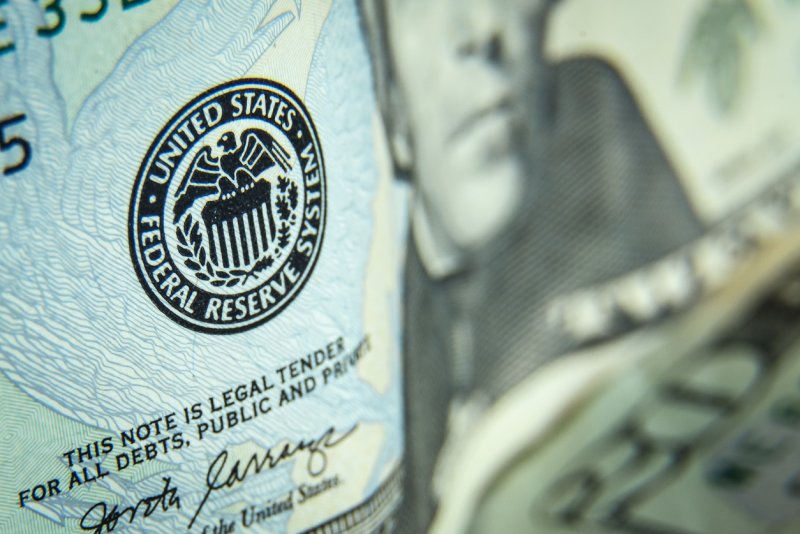 A close-up on the federal reserve seal on a 20 dollar bill.
