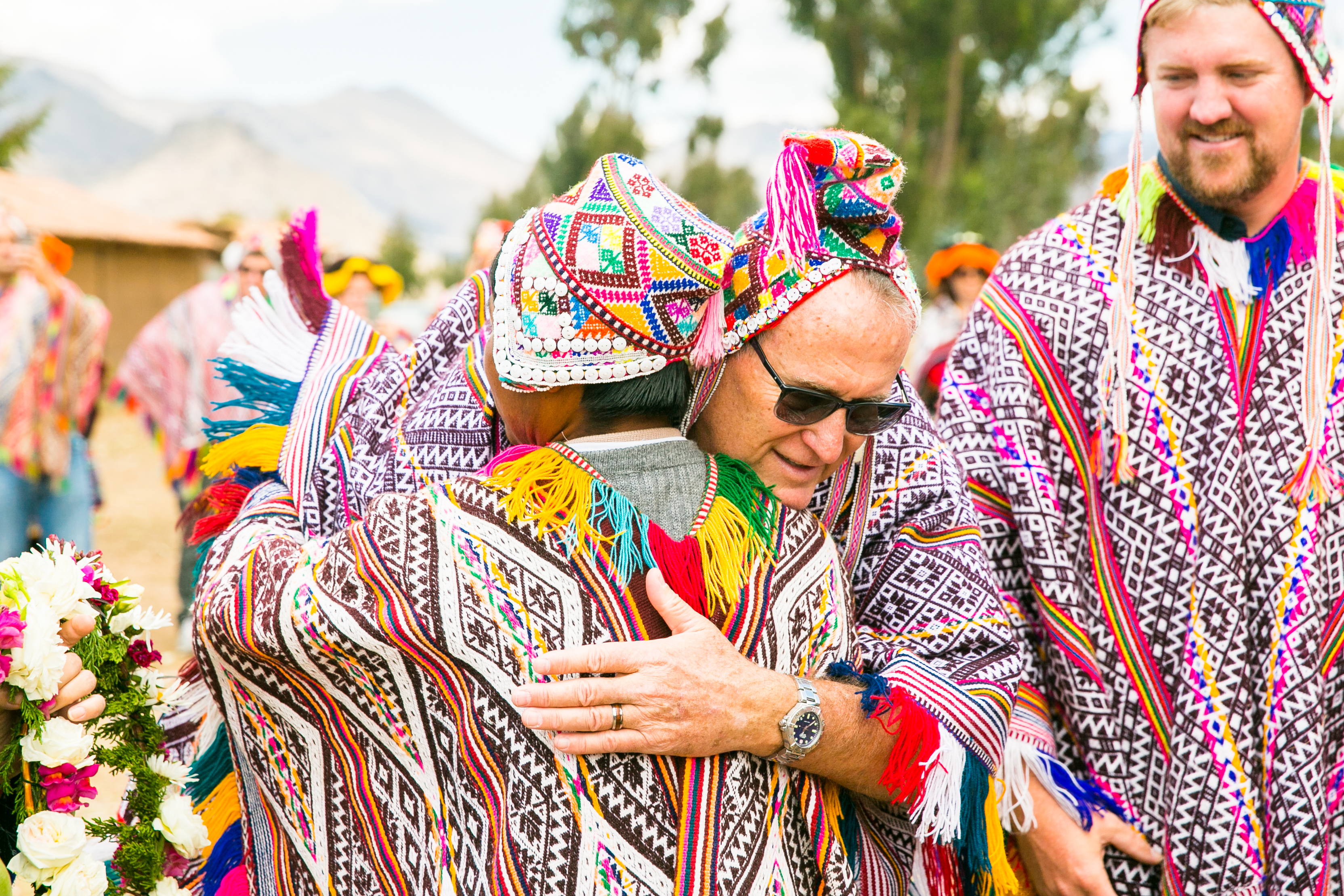 Academy Mortgage Founder Duane Shaw (left) and CEO Adam Kessler (right) greet local villagers on Academy's Service Expedition to Peru