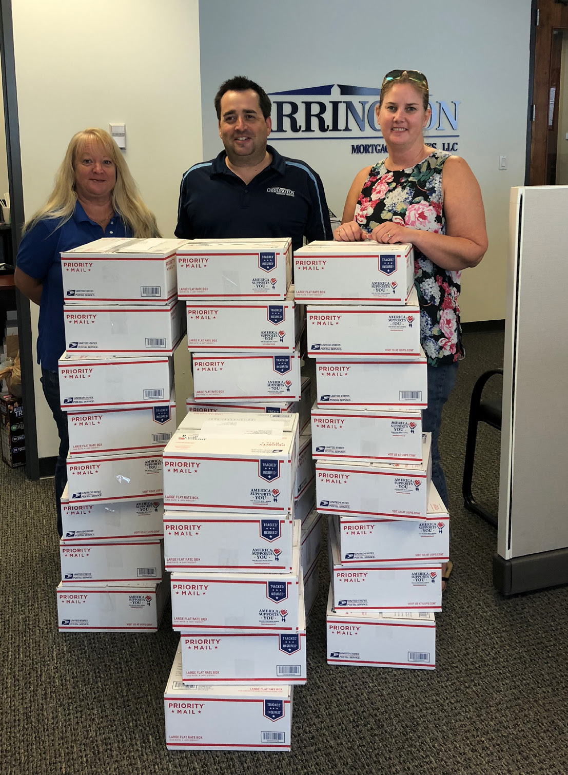 The Carrington Mortgage Services team in Lakeland, Florida, proudly packed boxes for overseas military servicemembers