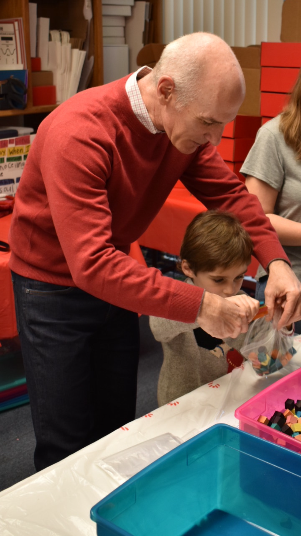 Dominic Iannitti, CEO of DocMagic, and his son Dominic Jr., helping with the Art Box project