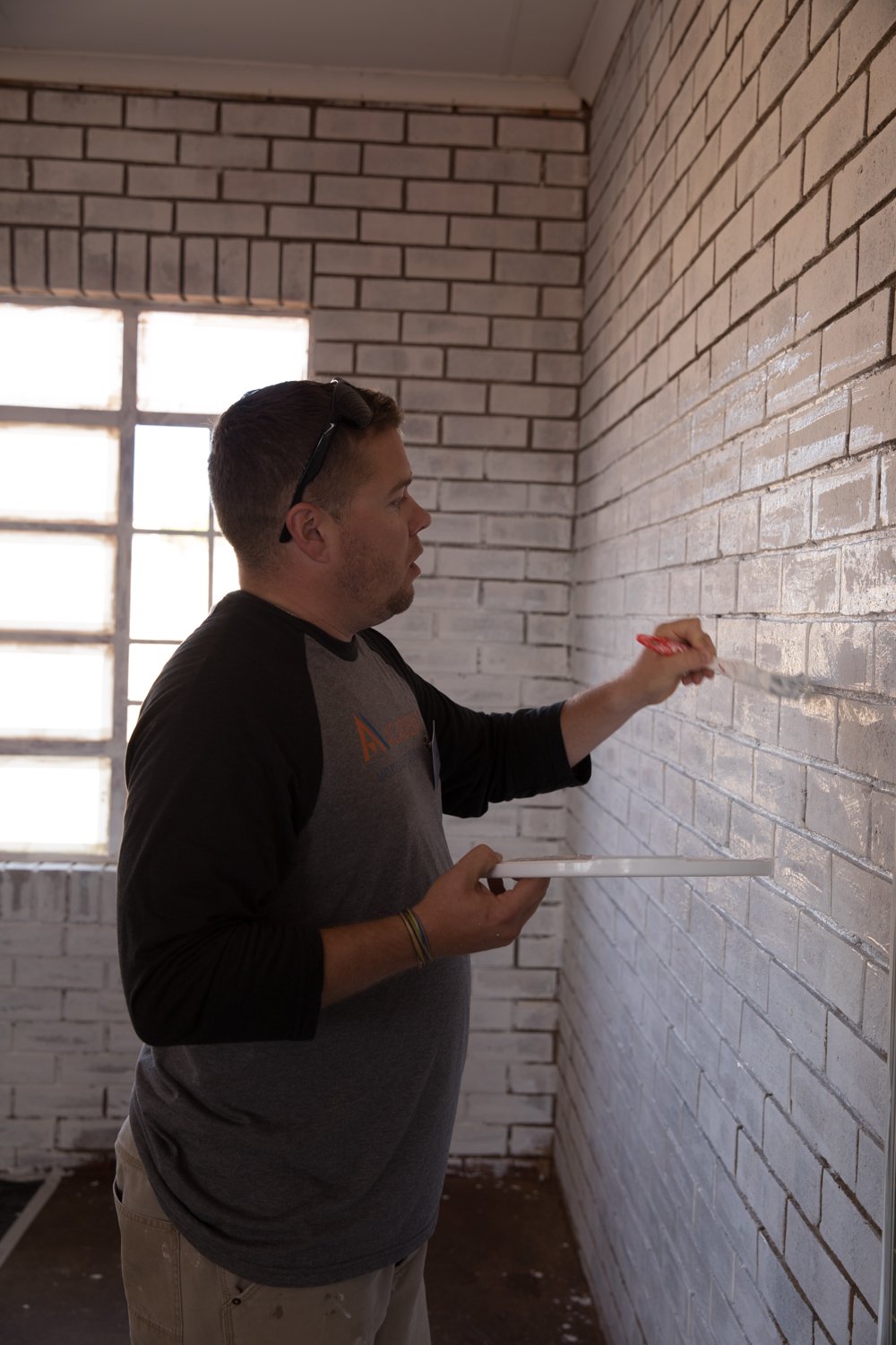Nick Staker paints a classroom at The Makwetse School