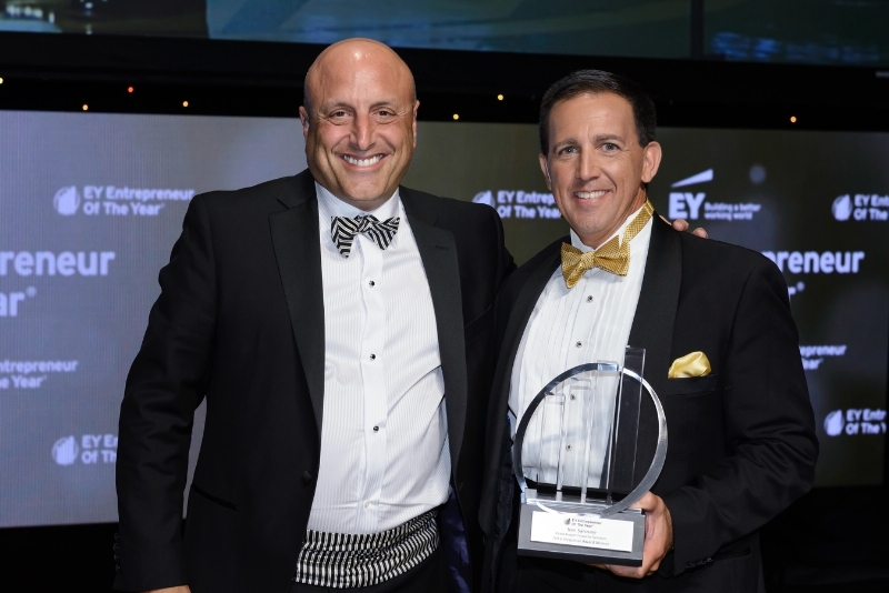 Black Knight Financial Services President and CEO Tom Sanzone (left) accepts his honor