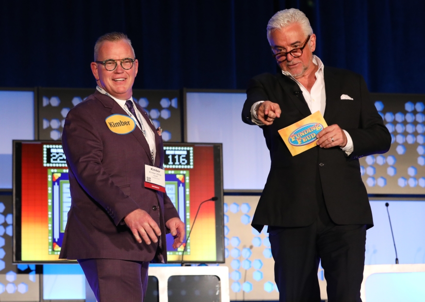 NAMB President-Elect Kimber White with actor and television personality John O’Hurley during the Velocity Mortgage Capital-sponsored Funding Feud event at NAMB National in Vegas