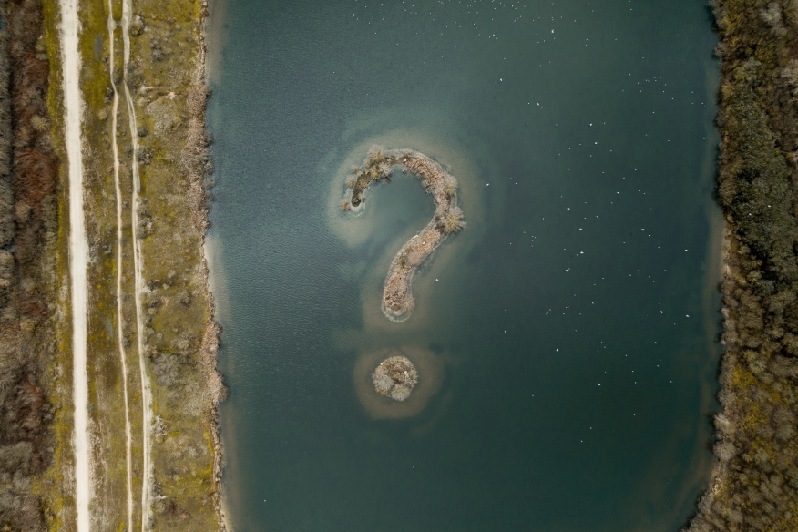Aerial view of island forming question mark.