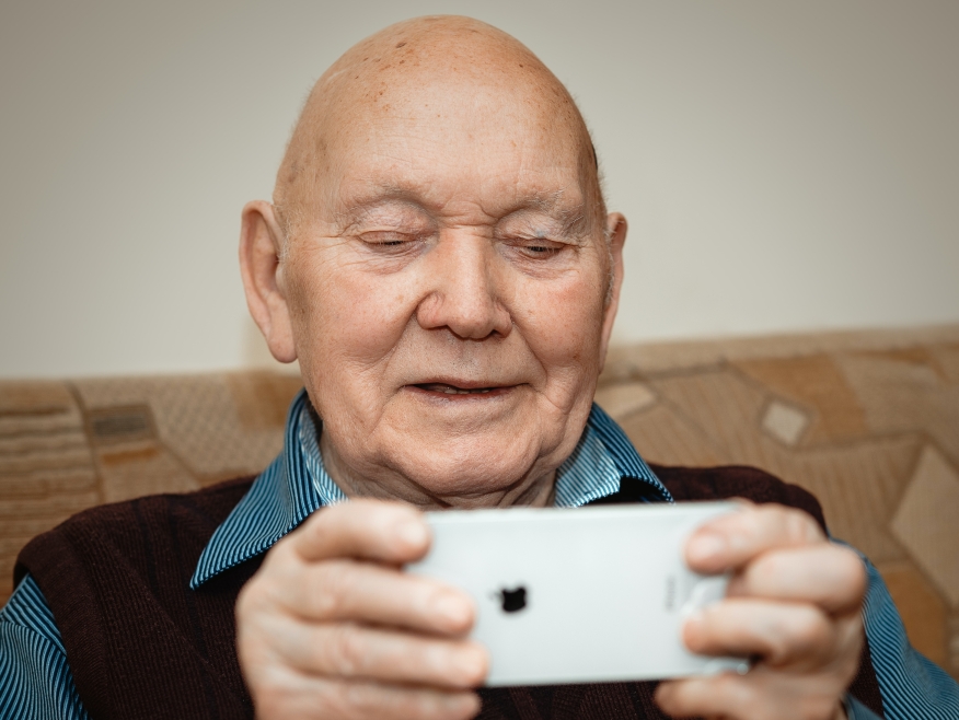Senior citizen using iPhone.