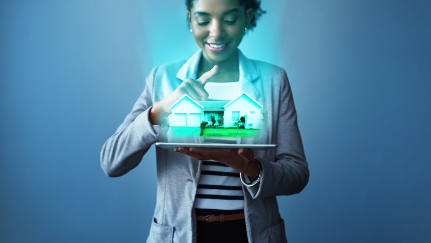 Woman with 3D image of a home. Credit: iStock.com/PeopleImages