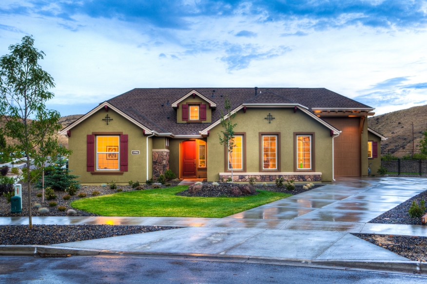 Home with wet driveway.