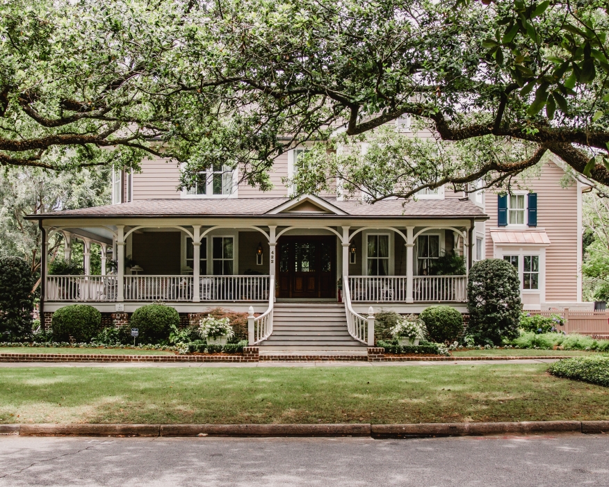 House shaded by trees.