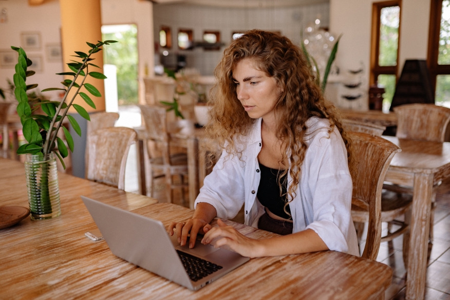 Woman working on her laptop from home.