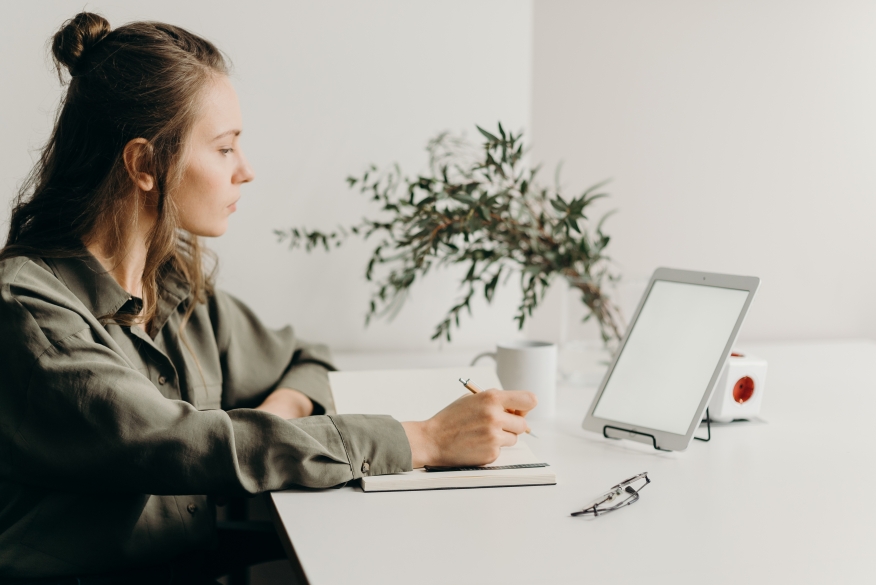 woman-in-gray-coat-using-white-laptop-computer | Photo by cottonbro from Pexels