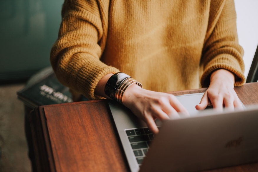 Woman using a laptop.