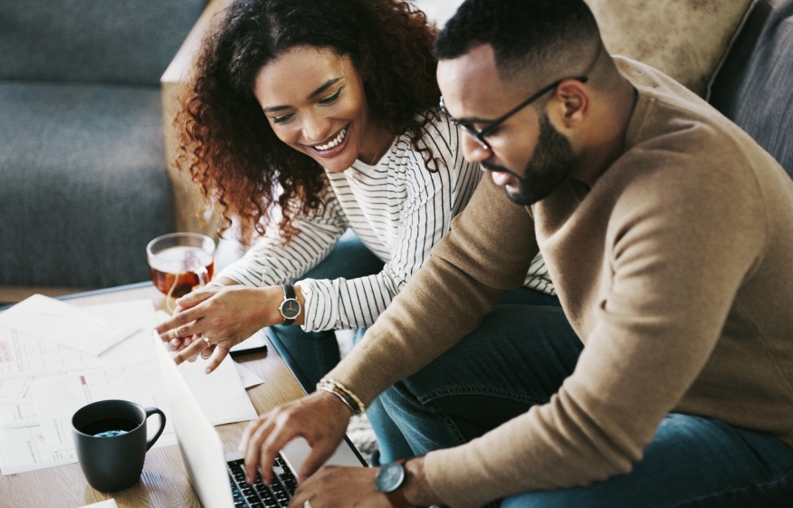 Couple using a laptop.