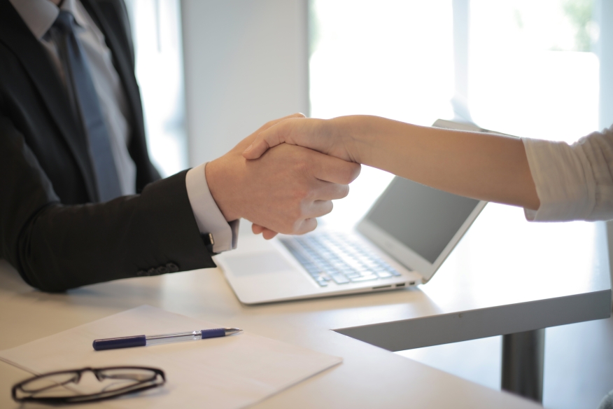 Photo of people shaking hands. 