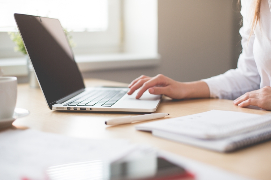 Woman using a laptop for work.