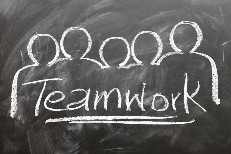 Teamwork written on a chalkboard.