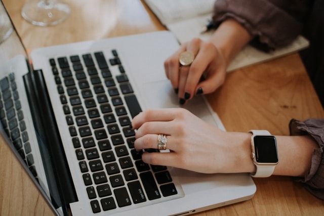 Woman working on laptop at home.