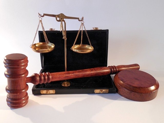 Photo of a gavel and a scale signifying regulation.
