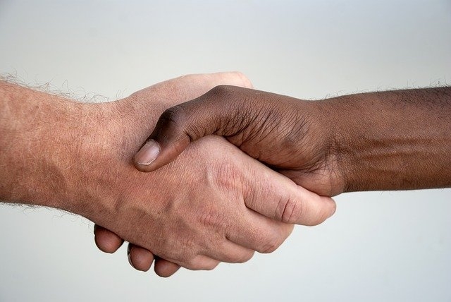 Two men shaking hands.