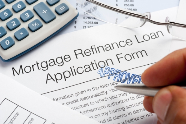 Photo of a mortgage refinance application. Credit: iStock.com/courtneyk