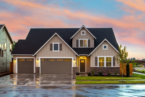 House in a suburban neighborhood after a rain storm.