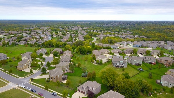 Aerial photo of homes in a suburban neighborhood.