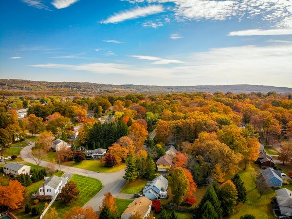 Aerial view of a suburban neighborhood during fall.