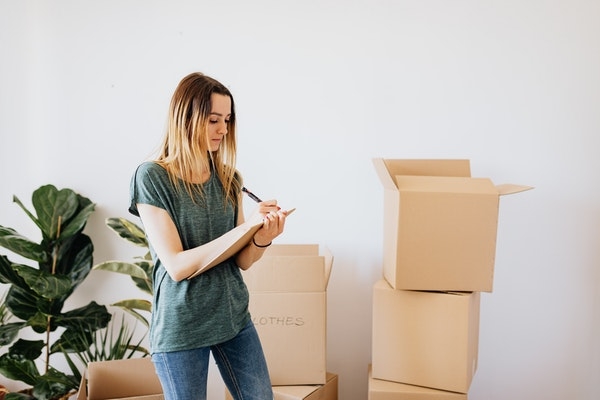 Woman moving into a new home.