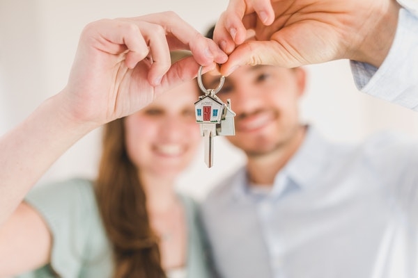 Photo of a couple purchasing a home for the first time.