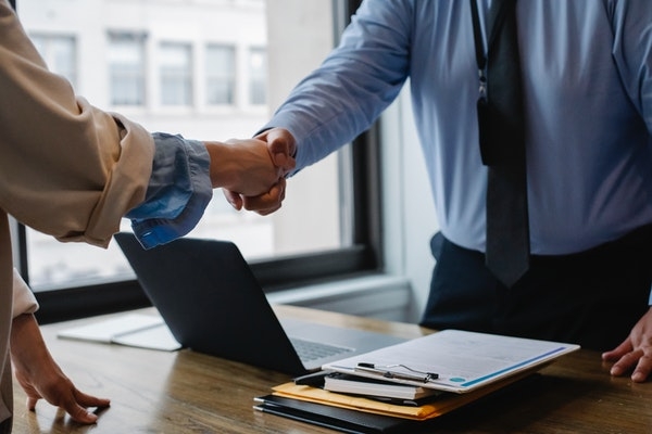 Photo of a new hire handshake