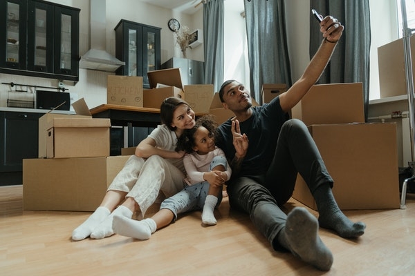 Photo of a family at home while moving in.