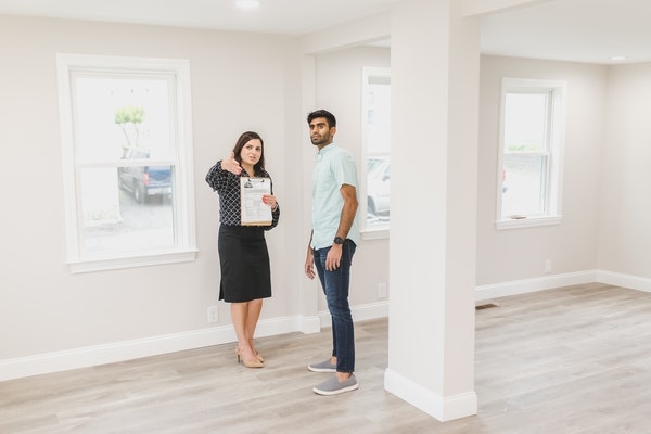 Photo of a homebuyer taking a tour of a new home.