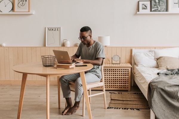 Photo of a man working from home.