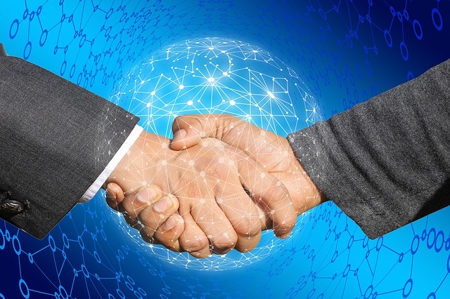 Photo of a digital handshake.
