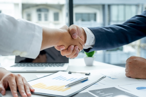 Photo of a business hire handshake. Credit: iStockphoto.com/Lucky7trader.
