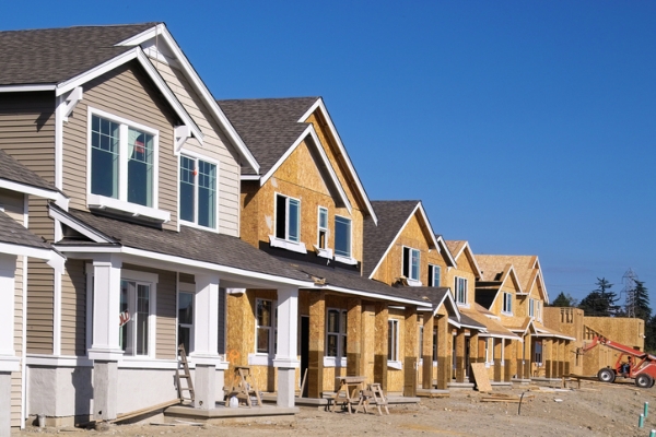 Photo of new homes being constructed. Credit: iStockphoto.com/jhorrocks.