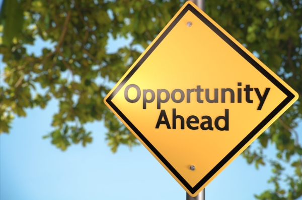 Photo of a sign that says opportunity ahead. Credit: iStockphoto.com/chaofann.
