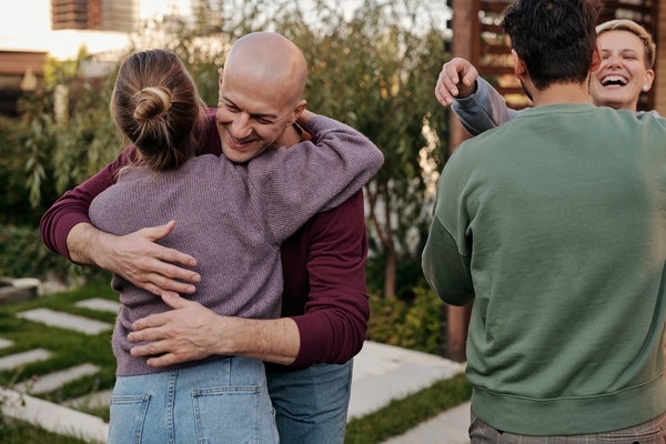 Photo of a family showing their support for one another.