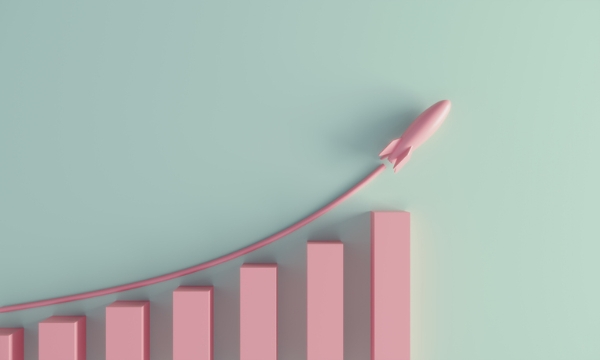 Photo of a pink 3D chart increased with a rocket ship representing the increase. Credit: iStockphoto.com/Eoneren.