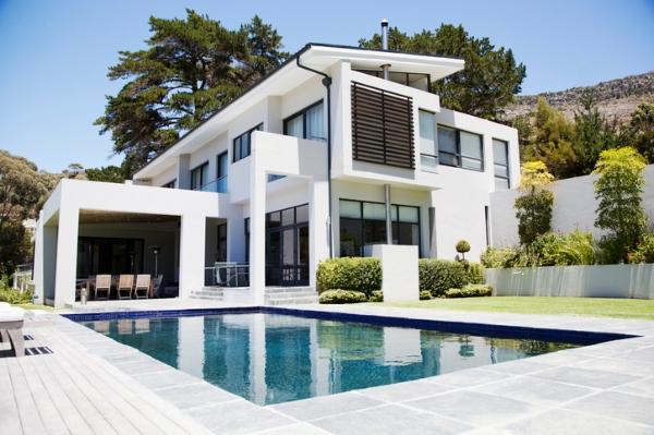 Photo of a large luxury home with a pool. Credit: iStockphoto.com/Robert Daly.
