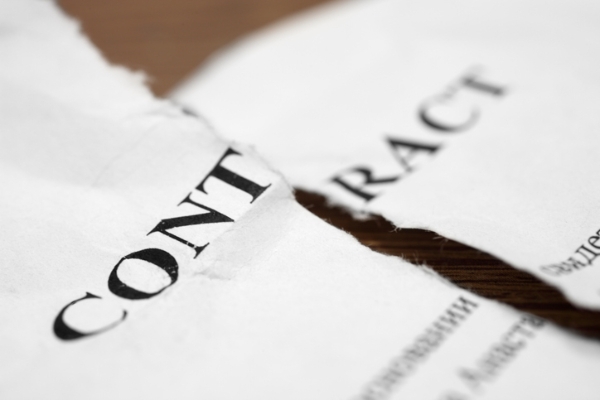 Photo of a torn contract signifying a deal-breaker. Credit: iStockphoto.com/Savushkin.