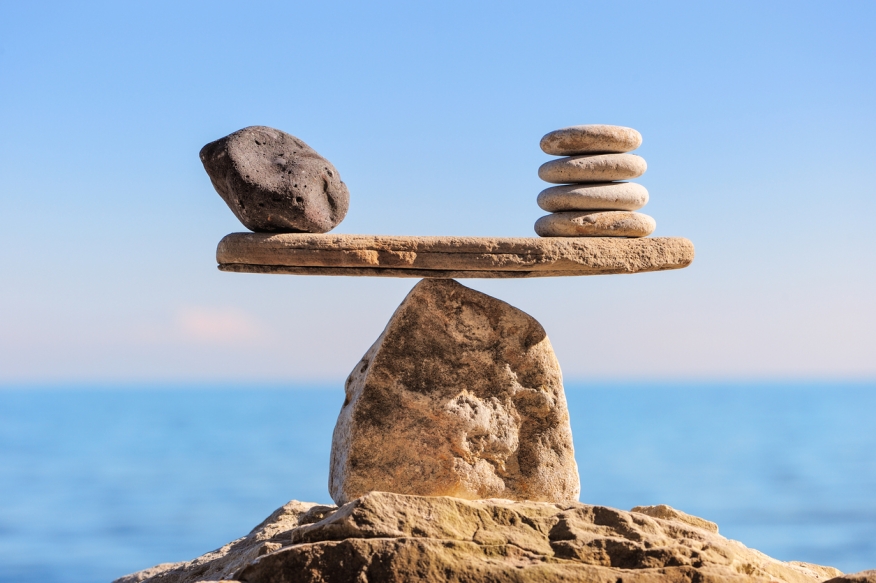 Rocks balance on a beam