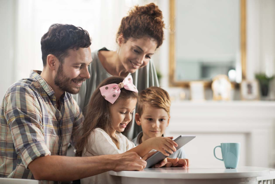 A family looking at a tablet