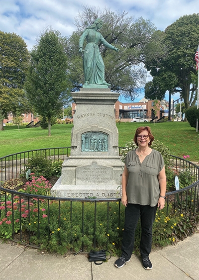 Suzy Lindblom with statue