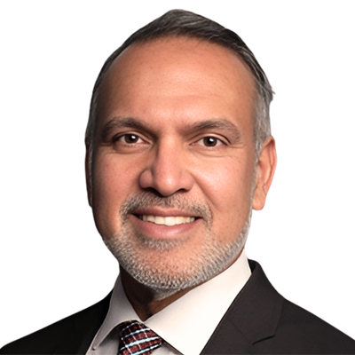 A man with medium tan skin and a gray beard.