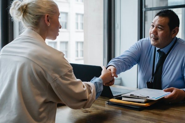 Photo of an employer recruiting a new employee.