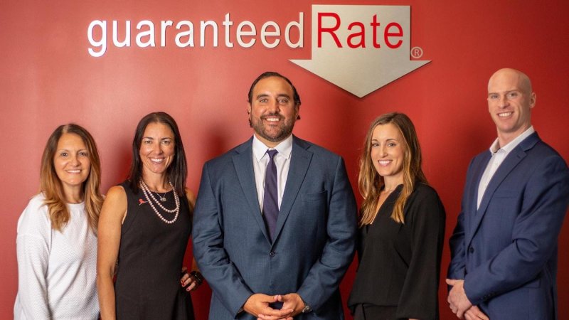 Shant Banosian stands with colleagues of Guaranteed Rate