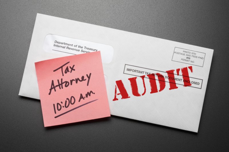 A letter from the IRS with red "AUDIT" stamp