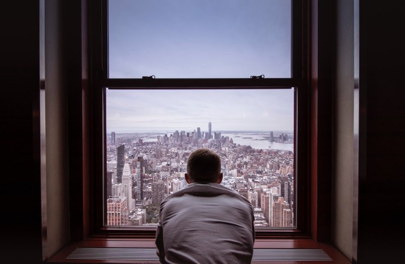 A man looks clearly over the city.